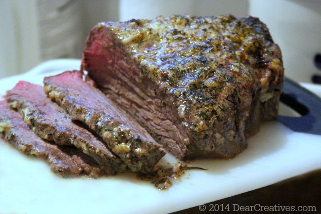 Roast Beef on a cutting board_partially sliced roast beef_