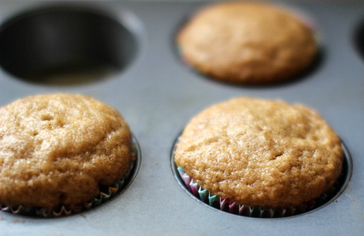 pumpkin muffins in a muffin tin just after they were baked pumpkin muffins recipe at dearcreatives.com