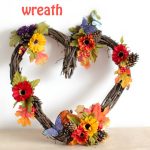 Heart Grapevine Wreath decorated for fall. You will want to make this quick and easy wreath plus door wreaths and grapevine wreath ideas at DearCreatives.com