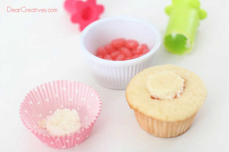 Add the tops back onto the cupcake covering up the jelly beans. Cupcake recipe and how to at DearCreatives.com