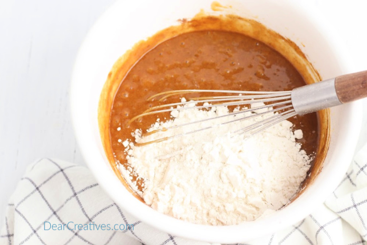 Adding the remaining flour for the pumpkin cookies. DearCreatives.com