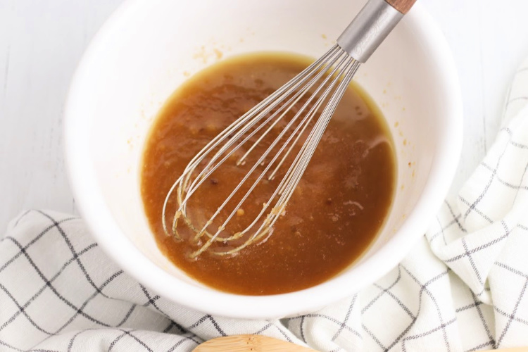 Mixing the melted butter and sugars for making oatmeal pumpkin cookies. Grab the cookies recipe at DearCreatives.com