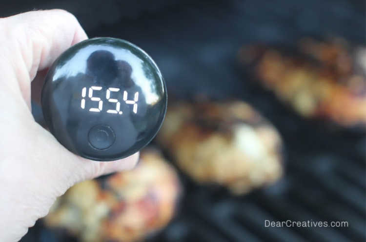 Checking-the-temperature-of-grilling-chicken-Chicken-Marinade-For-The-Grill-©-DearCreatives.com