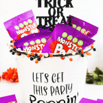 Halloween Party Bucket Filled With Monster Pop popcorn - For Monster Themed Parties and Halloween Parties. DIY...Find out more at © DearCreatives.com